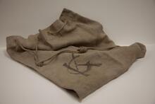 [Canvas bag stamped with "GK"]