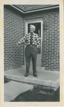 [Elderly man in checkered shirt and tie]