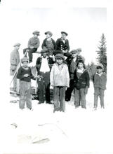 [Twelve boys standing in the snow]