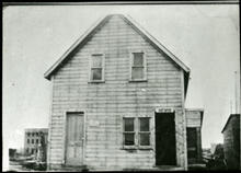 2-Storey wooden building marked "Post Office"
