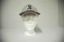 Grey ball cap with "S" for Shaunavon
