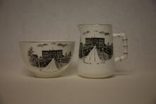 Ceramic cream and sugar set decorated with drawing of "Shaunavon Public and High School"