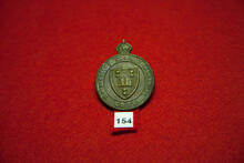 Universitas Saskatchewanensis C.O.T.C. [cap badge]