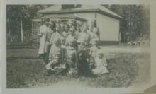 [Group of children in front of school?]