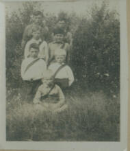 [Seven boys wearing sashes]