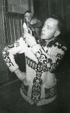 Man Feeding Banana To Monkey