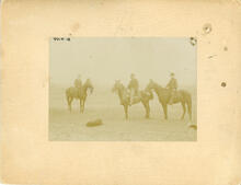 [Man and two boys on horseback]