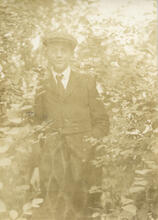 [Boy posing for a photograph]