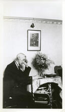 [Man at table]