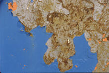 World map" on end of oil drum