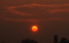 Sunset over barn and silo