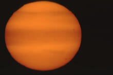 Setting sun, long lens